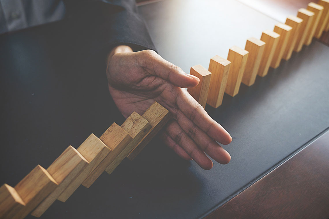 Dominoes as a Metaphor for Financial Roadblocks