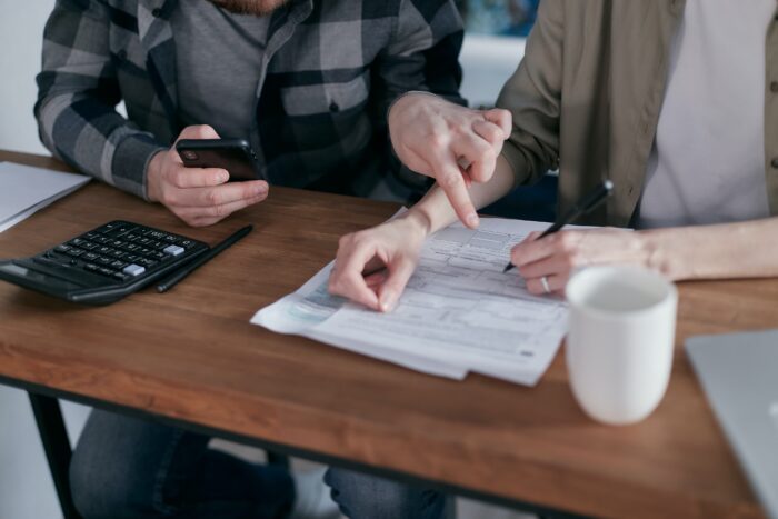 people calculating their debt