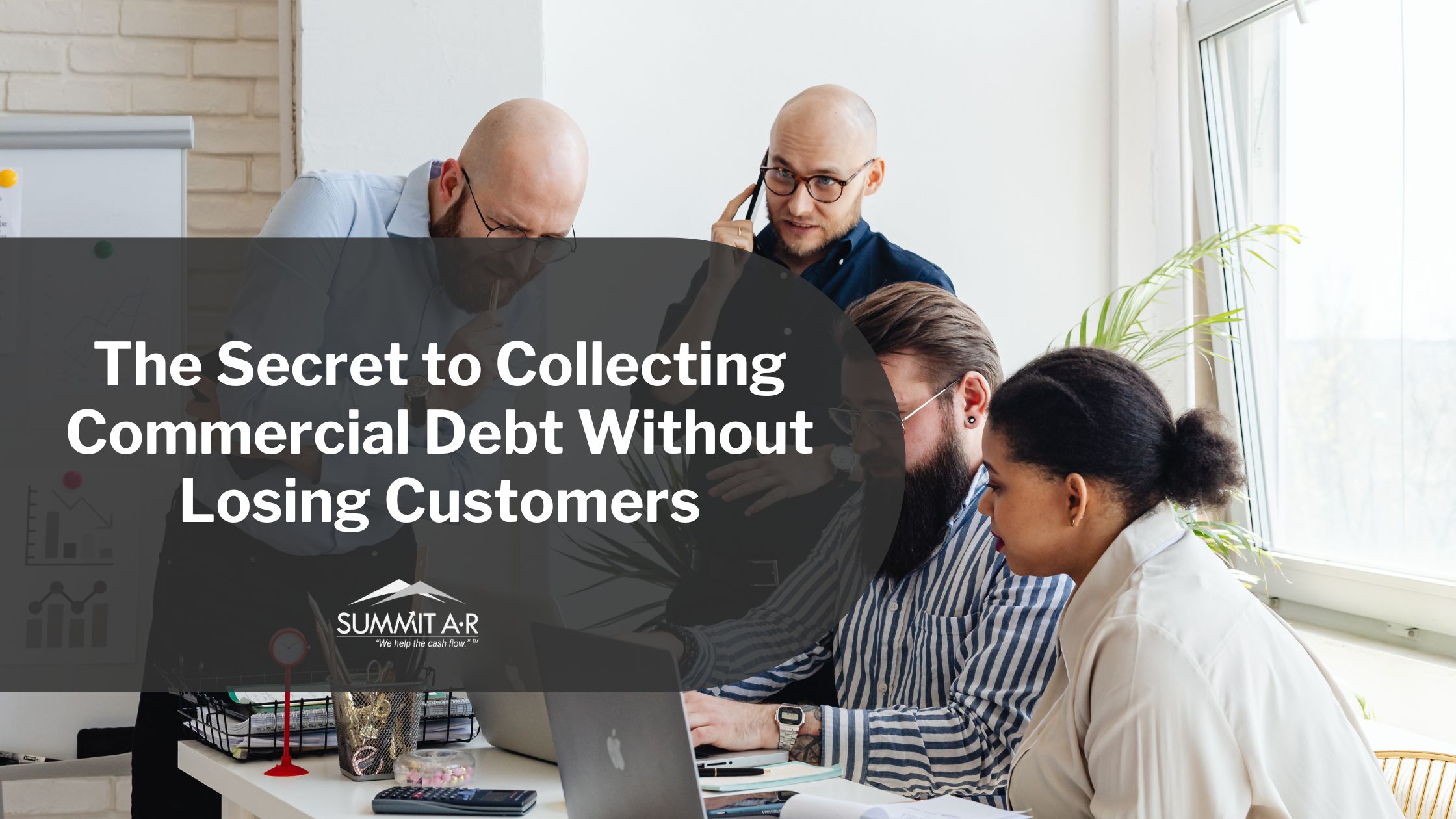 Business team collaborating in office on commercial debt recovery strategies, highlighting Summit A•R’s approach to collecting debt without losing customers.