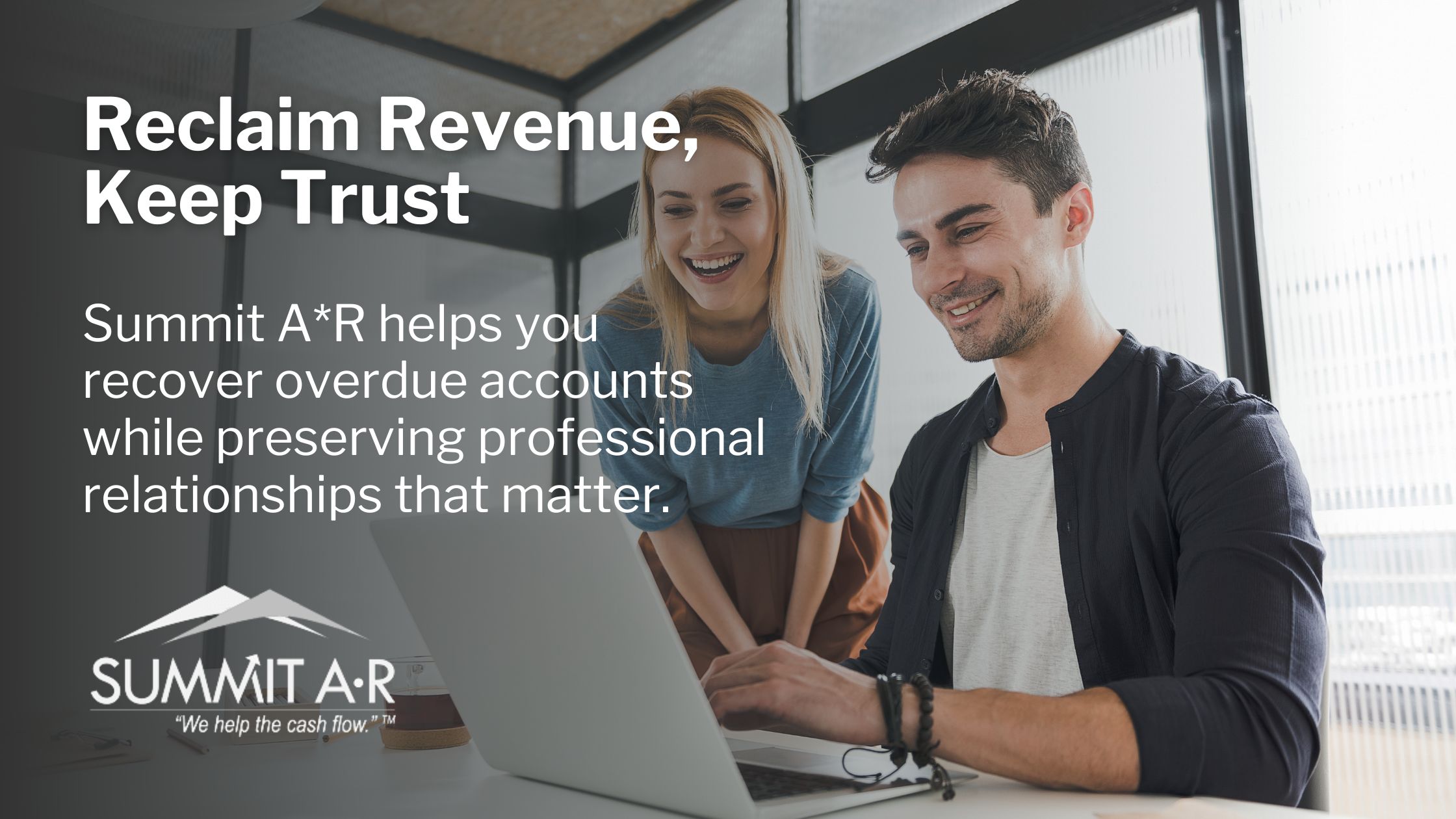 Two professionals reviewing overdue account recovery solutions on a laptop, representing Summit A•R’s respectful and trust-focused debt collection approach.