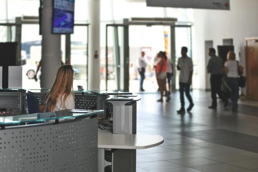 woman behind the desk in an office tower lobb