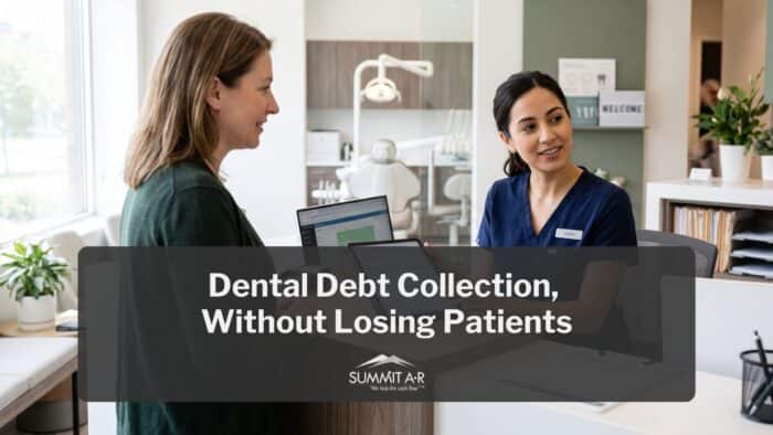 A dental receptionist in blue scrubs talks with a woman at the front desk of a modern dental office